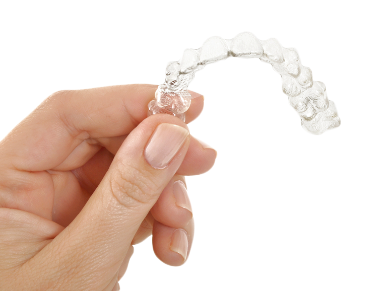 hand holding invisalign