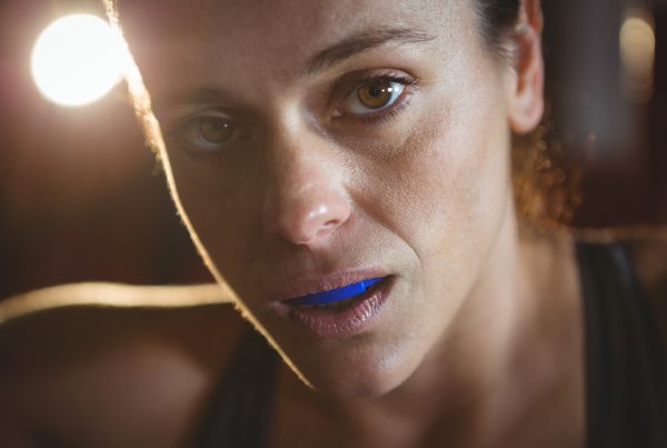 female boxer wearing mouthguard