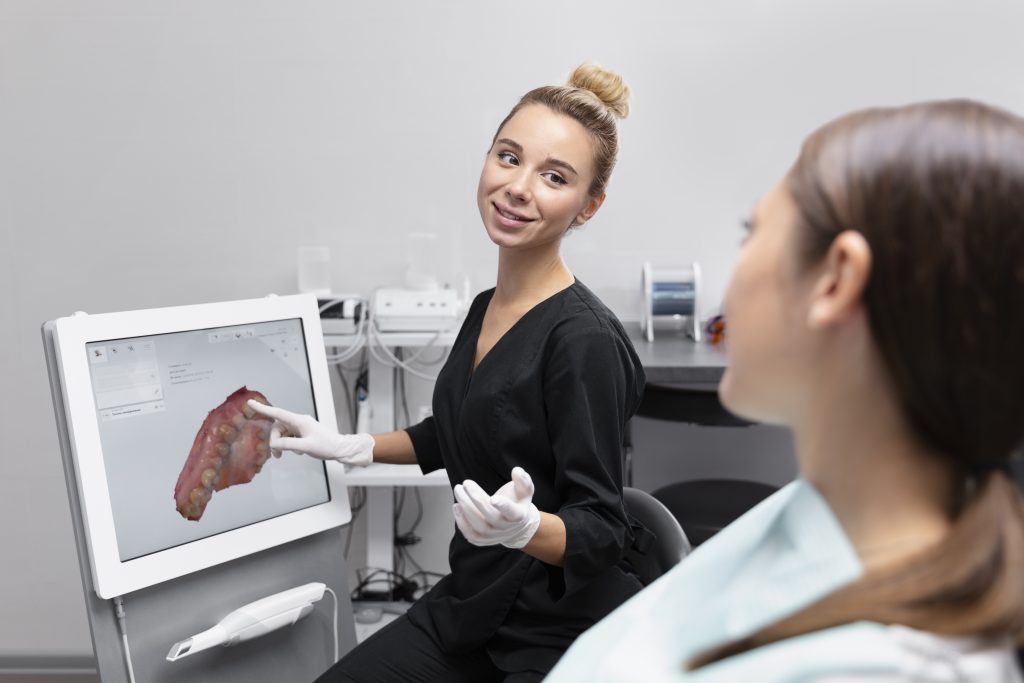 dentist showing digital scan of teeth to a patient