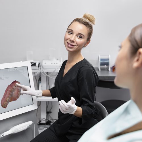 dentist showing digital scan of teeth to a patient